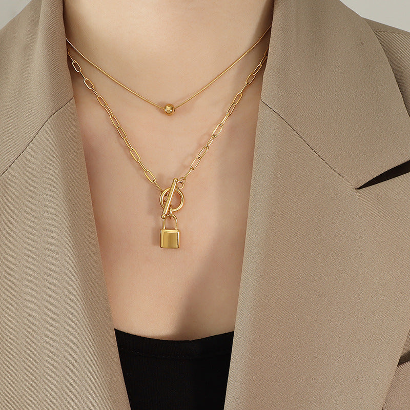 Cold and trendy OT buckle with two locks, steel ball pendant stacked with titanium steel necklace, exquisite women's jewelry 99.