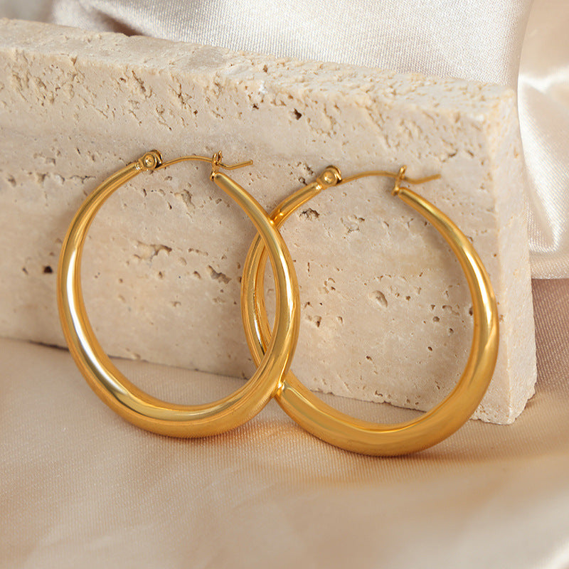 Light luxury high-end earrings, niche design sense, exaggerated temperament, titanium steel gold-plated large circle jewelry women