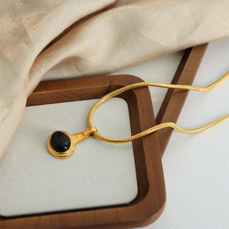 New retro light luxury fashion versatile titanium steel gold-plated glass bead pendant niche necklace jewelry design female pp