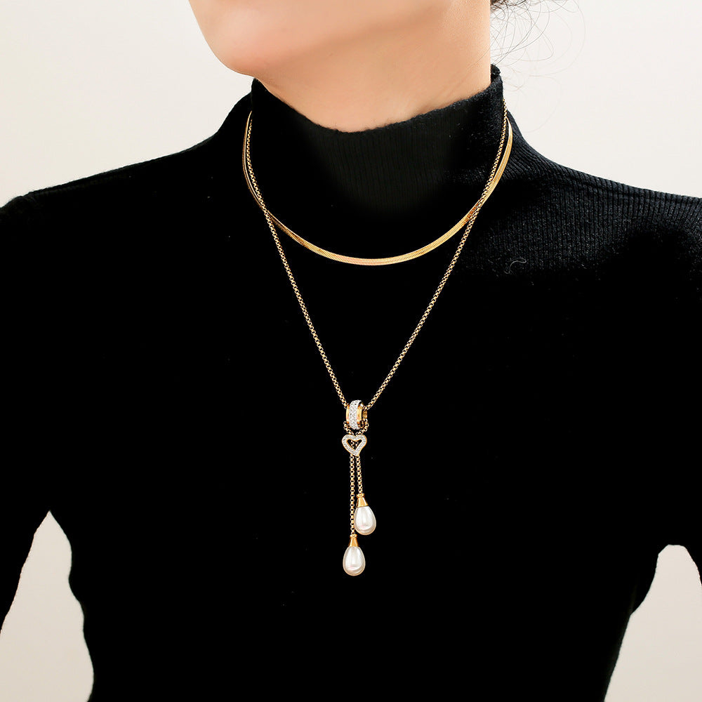 European and American light luxury buckle love tassel imitation pearl pendant necklace stainless steel gold-plated stacked necklace jewelry female pp
