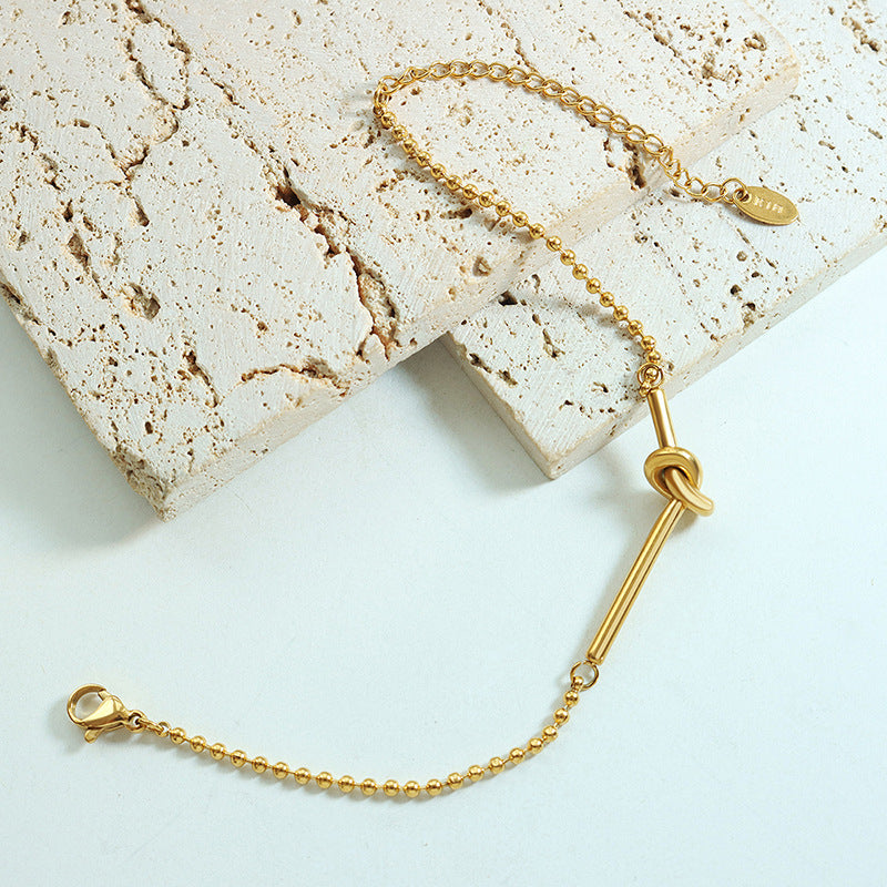Small lucky heart-shaped knotted bead chain mini bracelet female girlfriend personality trendy titanium steel plated 18k gold niche hand jewelry