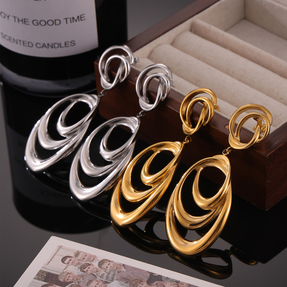 Hip-hop style, unique personality, niche exaggerated earrings, geometric line winding design sense, double-layer titanium steel gold-plated earrings