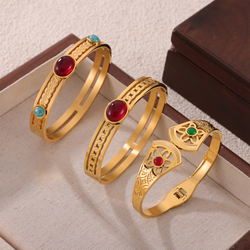 Hot-selling personality retro temperament elegant jewelry inlaid with natural stone design sense hollow titanium steel gold-plated bracelet pp