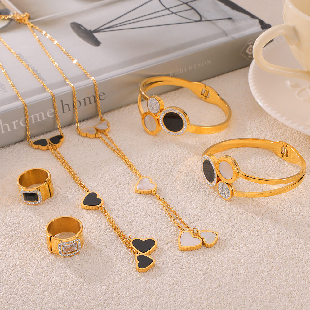 Temperament elegant light luxury zircon jewelry with diamond design sense Fritillary love titanium steel gold-plated jewelry set pp