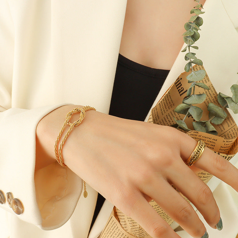 Cross-style geometric knotted bracelet female, niche design titanium steel gold-plated non-fading hand jewelry 99
