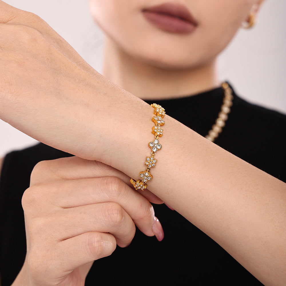 Stainless steel hand-inlaid zircon flower bracelet light luxury commuter plated 18k real gold spot