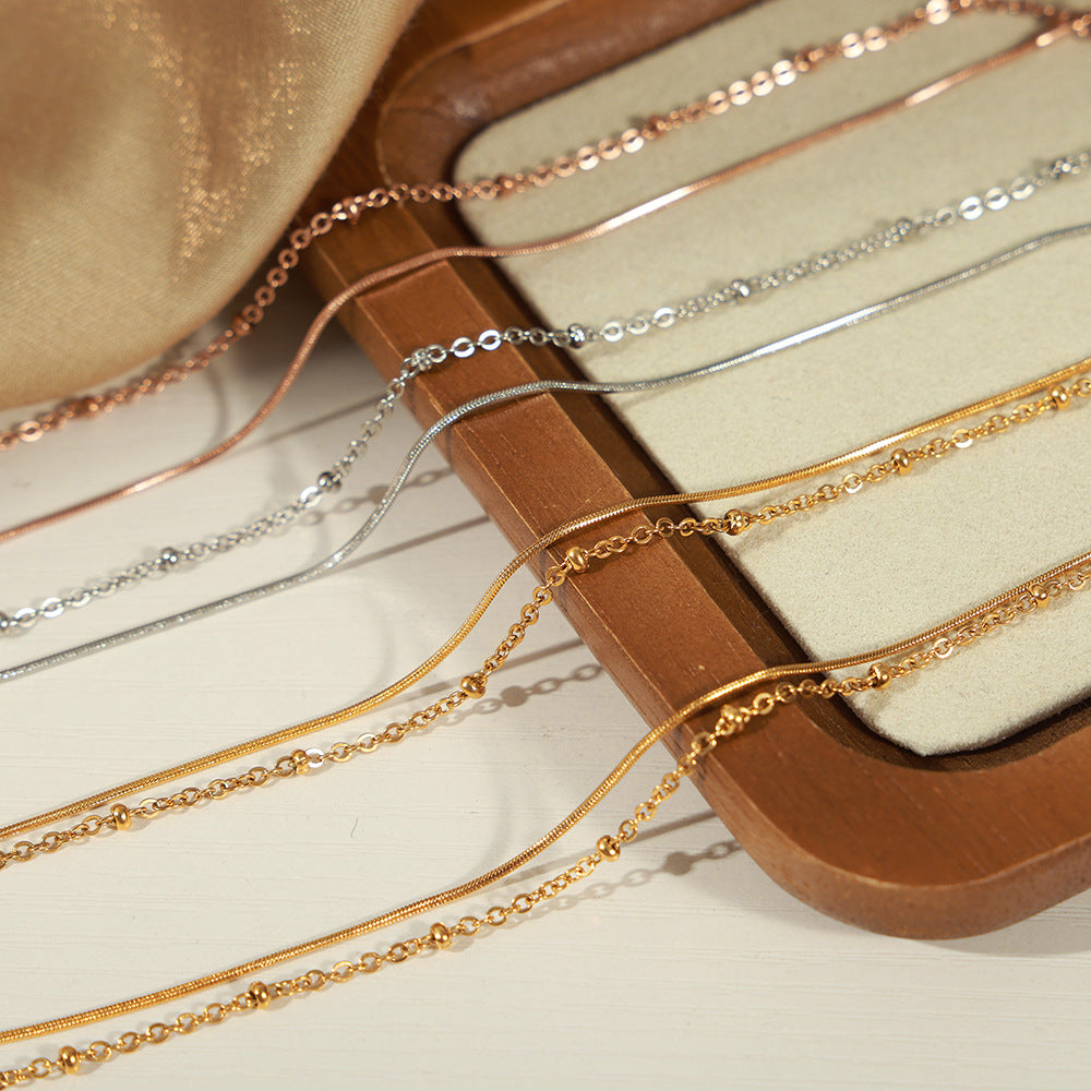 New simple personality niche design titanium steel gold-plated lobster buckle double-layer bracelet jewelry wholesale