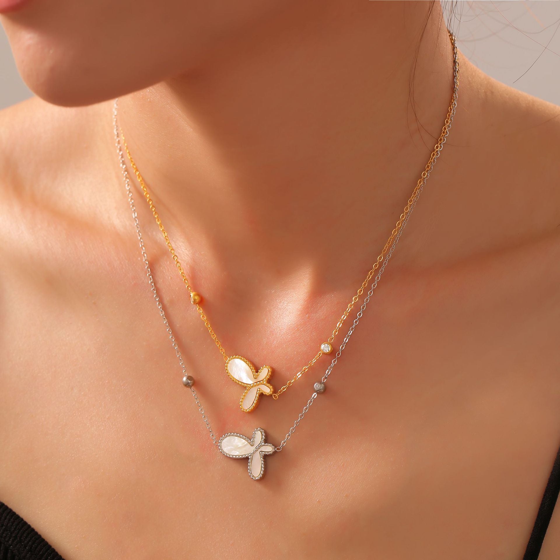 Elegant temperament gentle personality jewelry inlaid with white shell design butterfly pendant titanium steel gold-plated jewelry set