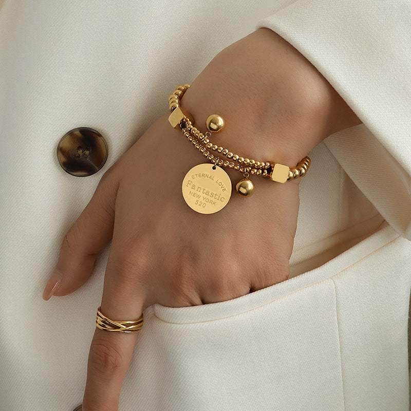 Retro titanium steel bracelet, plated with 18K gold steel ball love round brand elastic line double-layer stacked bracelet hand jewelry