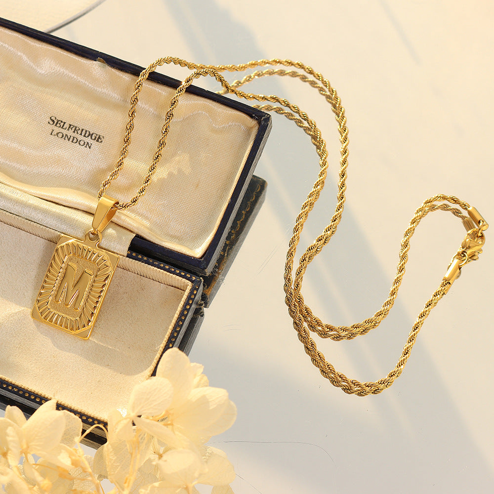 Cold wind niche light luxury retro high-end sense tag necklace titanium steel plated 18K real gold women's jewelry