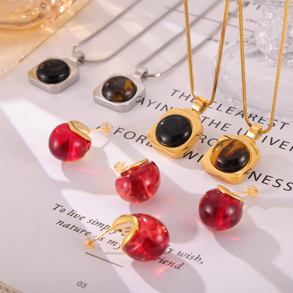 Hot-selling personalized light luxury jewelry inlaid with tiger's eye design titanium steel jewelry set pp