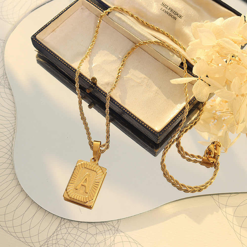 Cold wind niche light luxury retro high-end sense tag necklace titanium steel plated 18K real gold women's jewelry