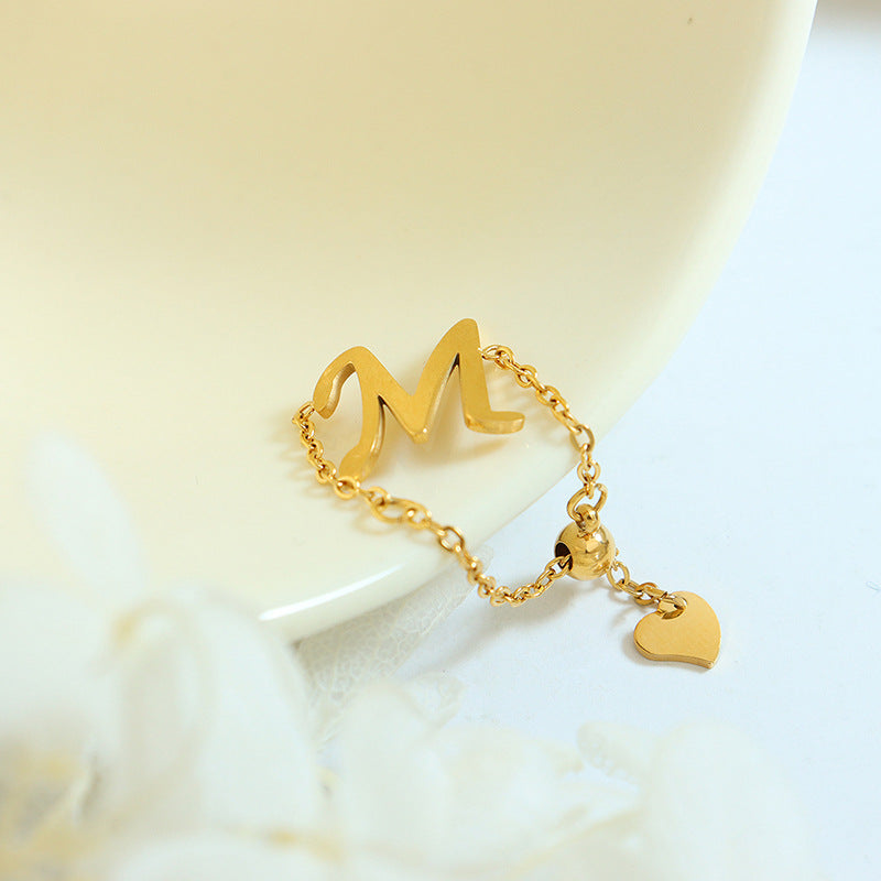 Cold wind simple M chain peach heart fingertip ring titanium steel gold-plated finger chain bracelet A124