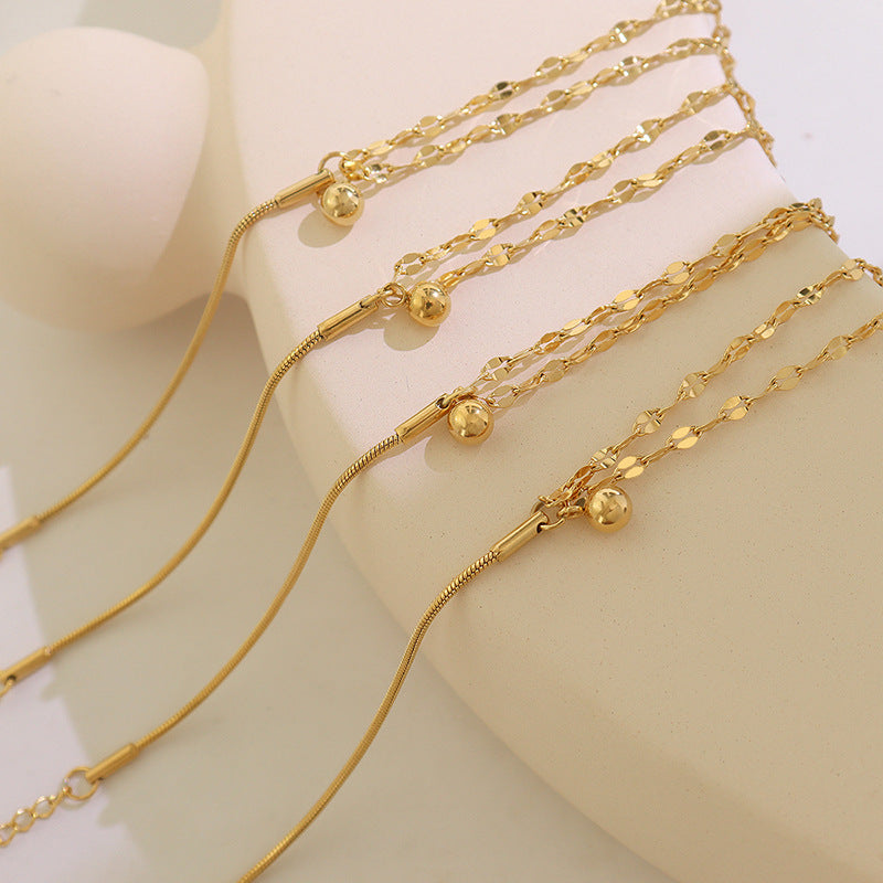 Detailed niche and versatile campus style double-layer lip chain bracelet, small steel ball pendant, titanium steel gold-plated jewelry E15299