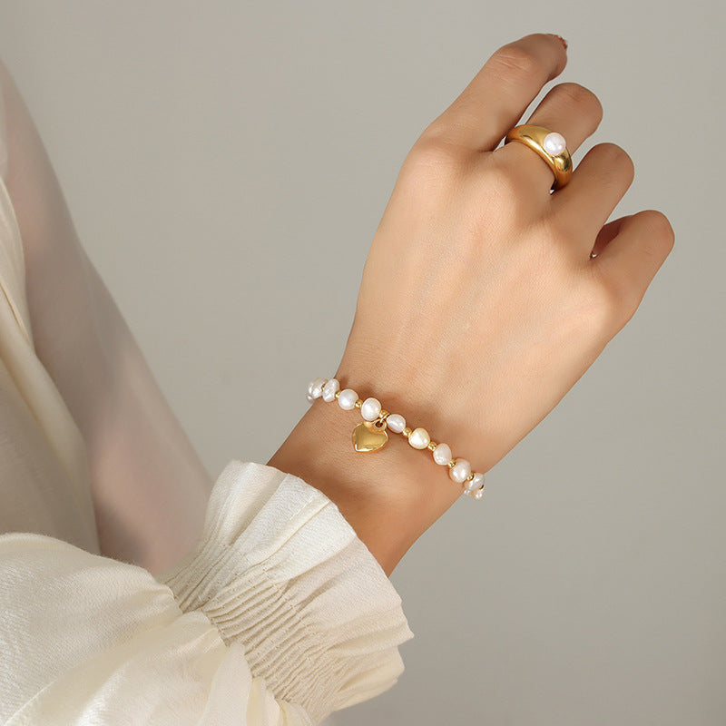 Personality temperament Freshwater pearl splicing steel ball bracelet women's fashion creative design peach heart pendant bracelet